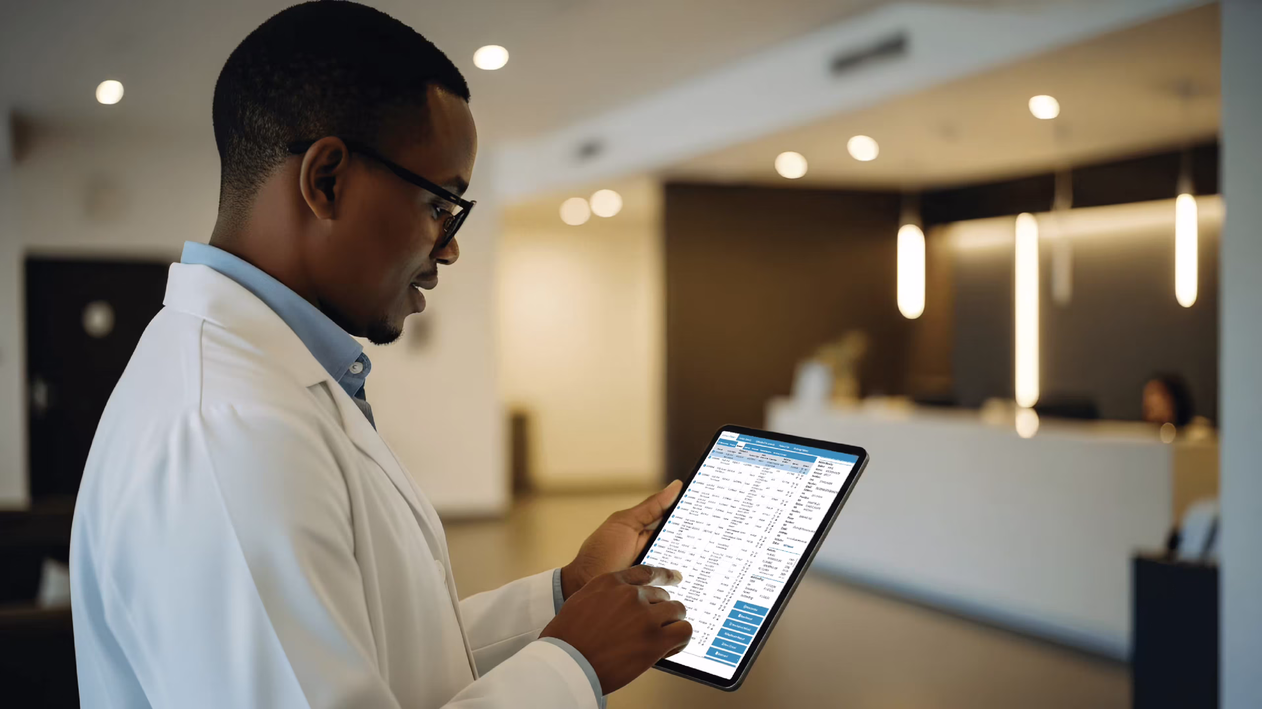 Doctor reviewing medical aid billing software claims on tablet in Namibia
